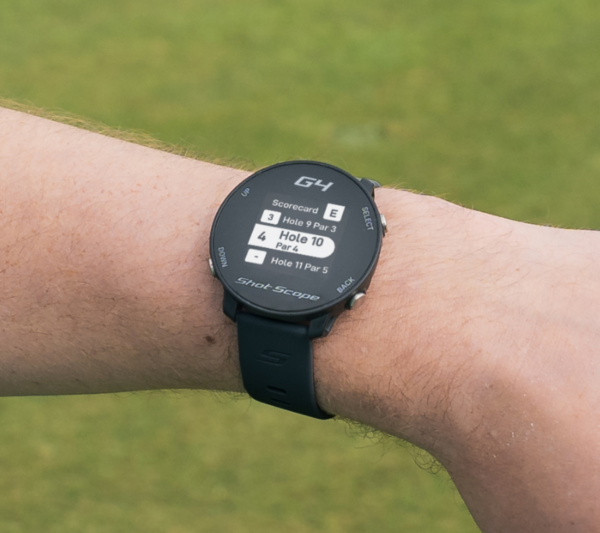 Male golfer wearing Black G4 GPS watch with scorecard