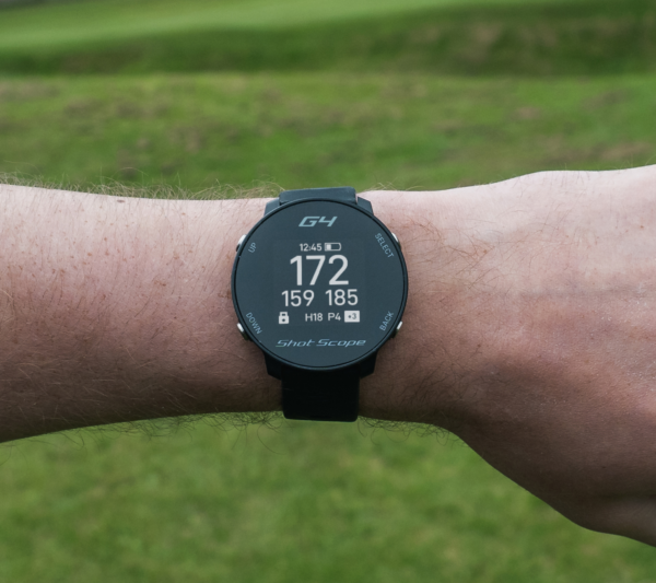 Male golfer wearing Black G4 GPS watch with front, middle and back screen