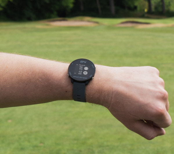 Male golfer wearing Black G4 GPS watch with hazard screen