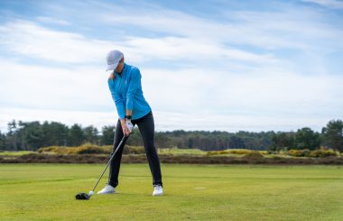 Female golfer, driver from tee