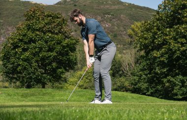 golfer hitting iron