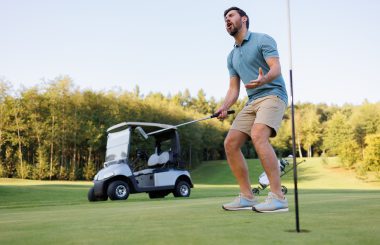 Passionate golfer on green