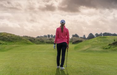 Female golfer middle of fairway