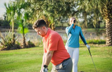 Male and female golfer on golf course