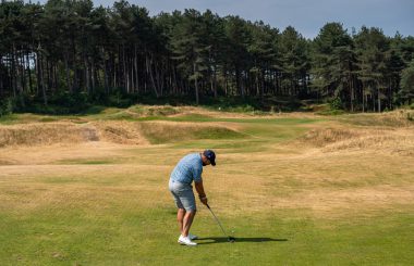 Peter Finch hitting shot from fairway