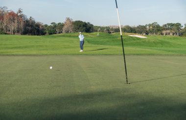 Jen Saxton chipping onto green