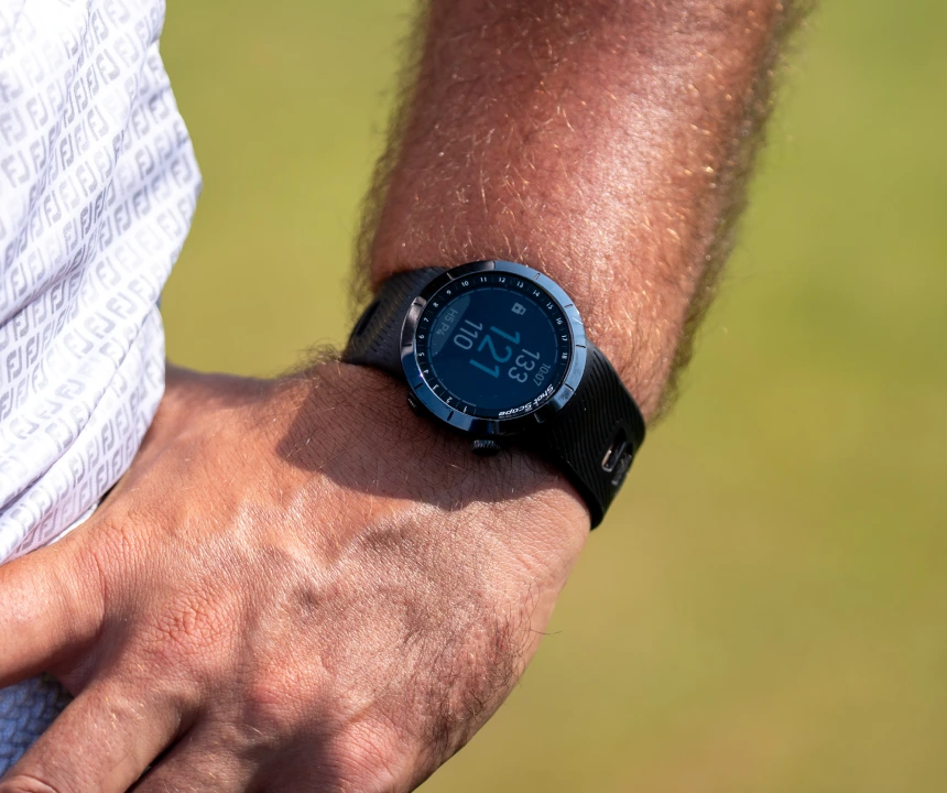 Golfer with hand in pocket and X5 on wrist