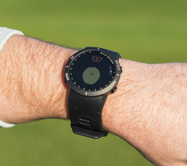 Male golfer wearing Black V5 GPS watch with green view screen