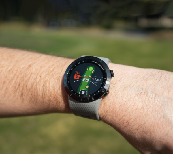 Male golfer wearing Grey X5 GPS watch with Full hole maps