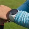 Female golfer wearing white X5 GPS watch