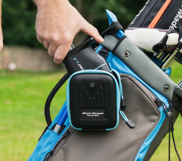 Male golfer taking Blue PRO LX+ rangefinder out of Shot Scope carry case