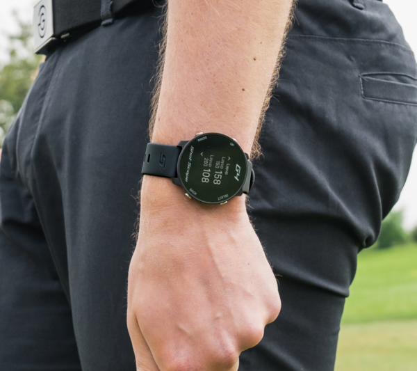 Male golfer wearing Black G4 GPS watch with layups screen