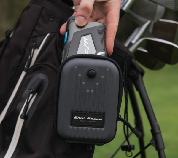 Male golfer taking PRO ZR rangefinder out of Shot Scope carry case