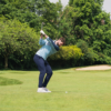 Male golfer hitting a shot wearing black G4 GPS watch