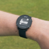 Male golfer wearing Black G4 GPS watch with scorecard