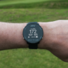 Male golfer wearing Black G4 GPS watch with front, middle and back screen