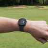 Male golfer wearing Black G4 GPS watch with hazard screen