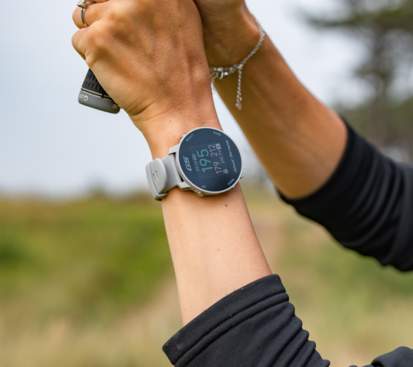 Female golfer wearing steel grey G5 watch