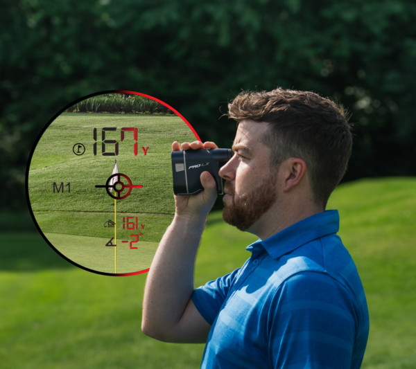 Male golfer using Grey PRO LX rangefinder, side view with rangefinder dual optics