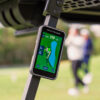 Shot Scope H50 GPS Handheld attached to golf cart with built-in cart magnet