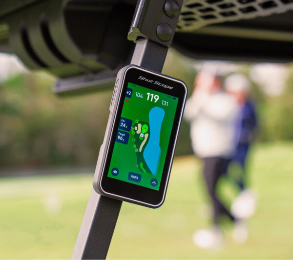 Shot Scope H50 GPS Handheld attached to golf cart with built-in cart magnet