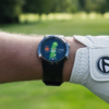 Male golfer wearing Prestige black X5 GPS watch with Full hole maps