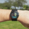 Male golfers wearing Prestige black X5 GPS watch with green view