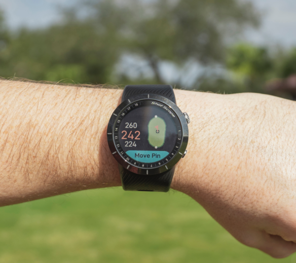 Male golfers wearing Prestige black X5 GPS watch with green view