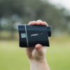 Male golfer holding Grey PRO L2 rangefinder showing left side