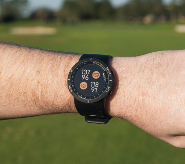 Male golfer wearing Black V5 GPS watch with hazards screen