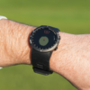 Male golfer wearing Black V5 GPS watch with green view screen