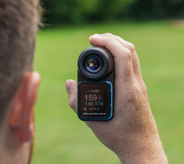 Male golfer holding Blue PRO LX+ rangefinder front back showing GPS handheld