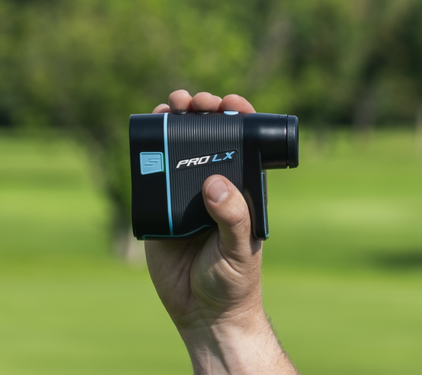 Male golfer holding Blue PRO LX rangefinder showing slope switch