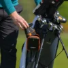 Golfer putting 1st Gen PRO LX+ in carry case