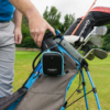 Male golfer taking blue PRO LX+ rangefinder out of carry case