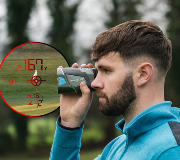 Male golfer using PRO ZR rangefinder, side view with rangefinder dual optics