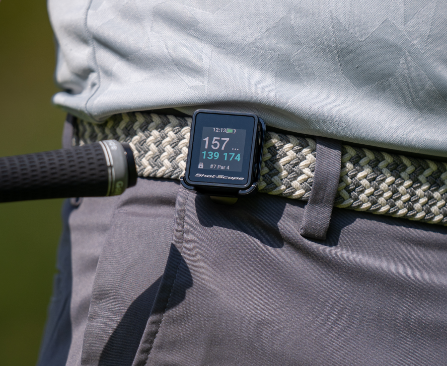 golfer tagging the h4 handheld which is attached to his belt