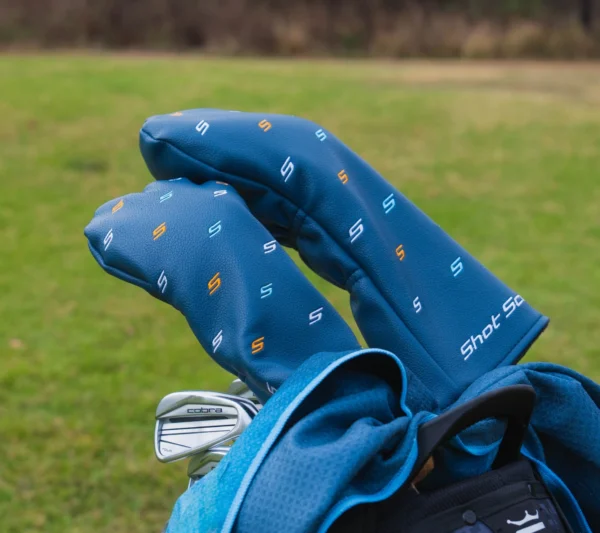 Shot Scope headcovers on golf clubs in a bag