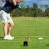 Shot Scope LM1 Launch Monitor on golf course with golfer